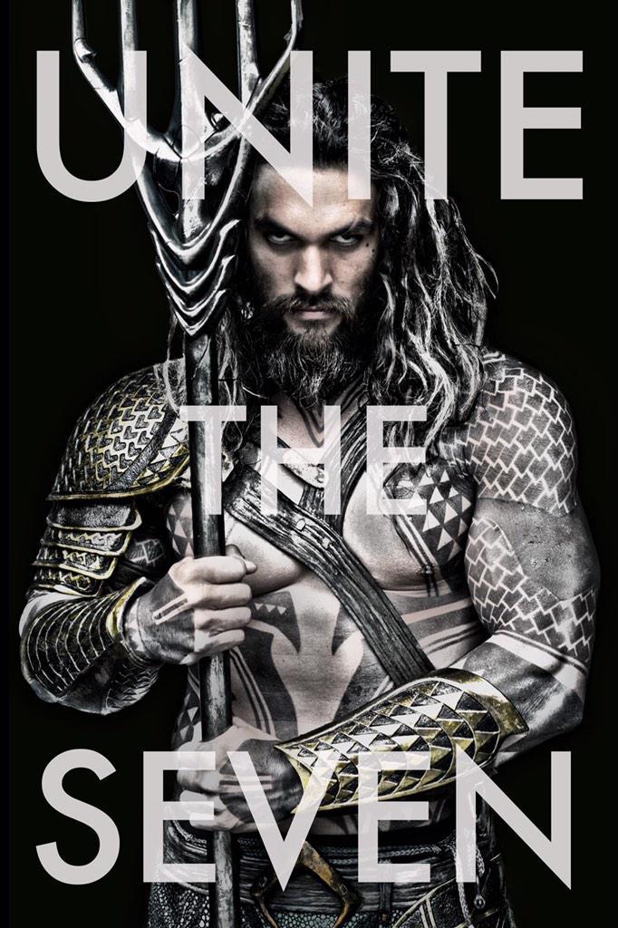 aquaman shot of jason momoa. he looks badass and is holding a trident