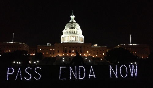 Photo of the Capitol building at night, with the words 