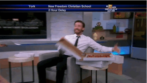 Chris Evans laughing with pizza