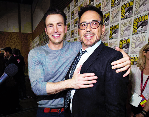 Chris Evans touching Robert Downey Jr
