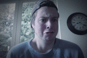 Gif of a slowly increasing closeup of a boy's comically uncomfortable face