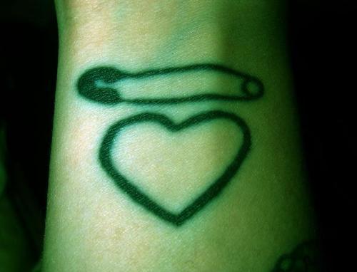 I got this tattoo as a reminder not to do it. I got the safety pin and heart 