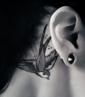 Small Bird Tattoo Behind Ear