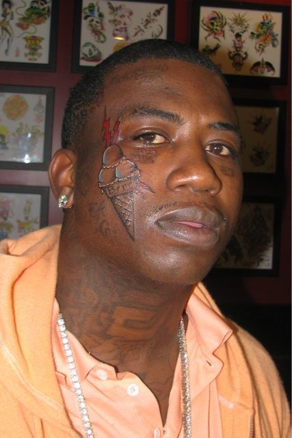 Rapper Gucci Mann sporting his new face tattoo of an ice cream cone