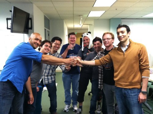 image of a group of guys toasting at get satisfaction company