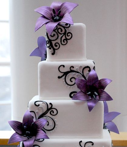 White and black wedding cakes with red flowers
