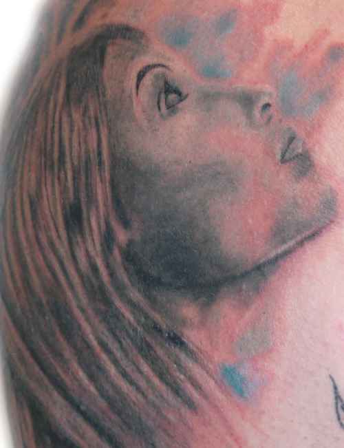 female face tattoo