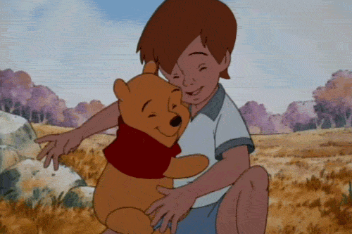 Pooh and Christopher Robin hugging