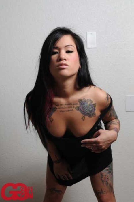 Symone is a sexy tattooed babe in a tight little black dress