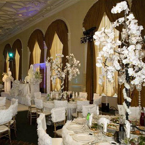 The guests of the wedding reception entered into a forest of white and 