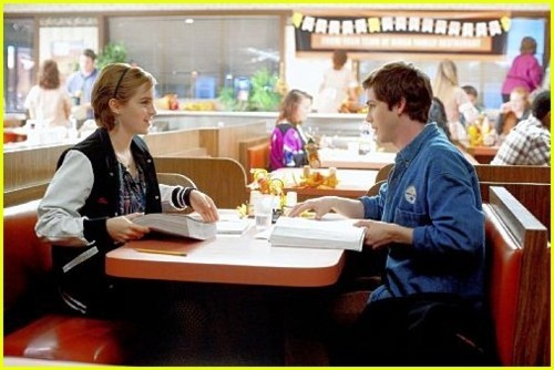 Emma Watson sits in a diner with Logan Lerman in this new still from The 