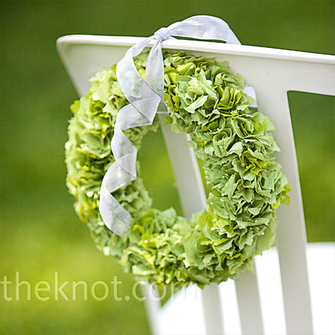 Cute green chair decoration for aisle chairs at an outdoor wedding