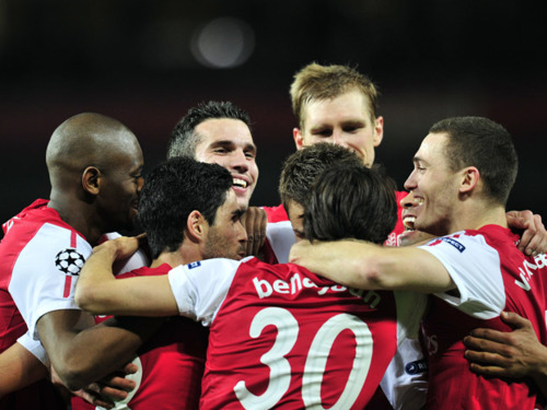 Arsenal players celebrate after their win