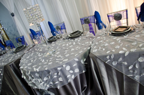 You could add texture or sheen to your head table with overlays or runners