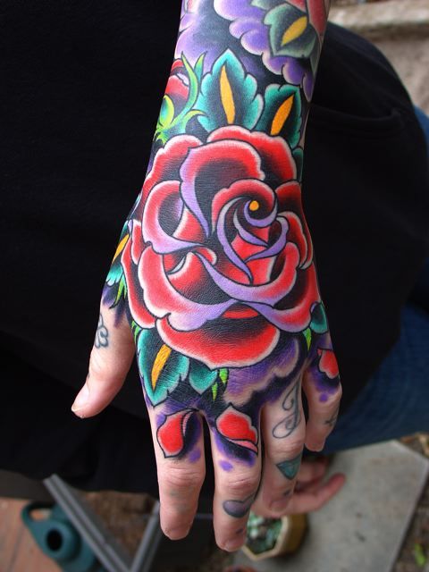 Rose Tattoo on hand Very colorful rose tattoo