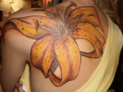 Lily tattoos are common and very beautiful tattoo design