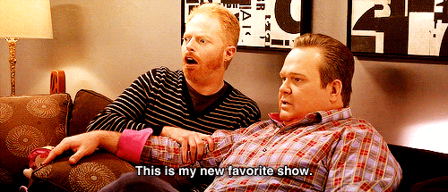 Gif of two men on a couch saying "This is my new favorite show"