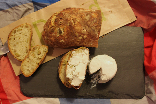 Crottin on black slate with truccio doni olive bread