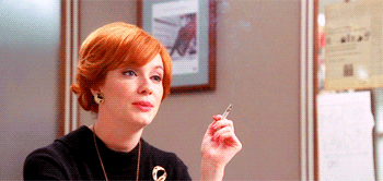 joan halloway laughing at you with cigarette gif