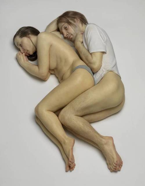 Couple sleeping spooning naked